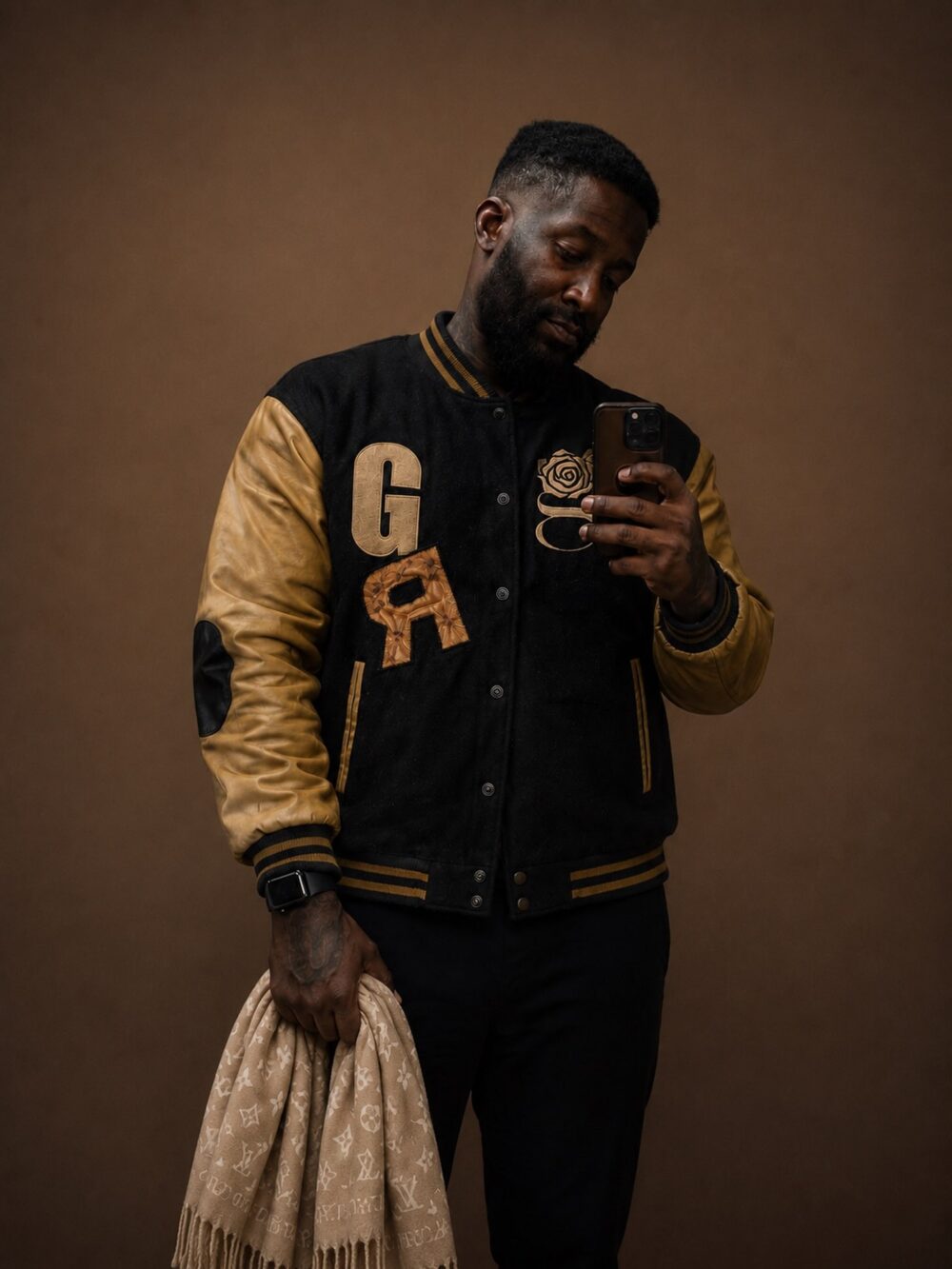 G Varsity, all black — flat